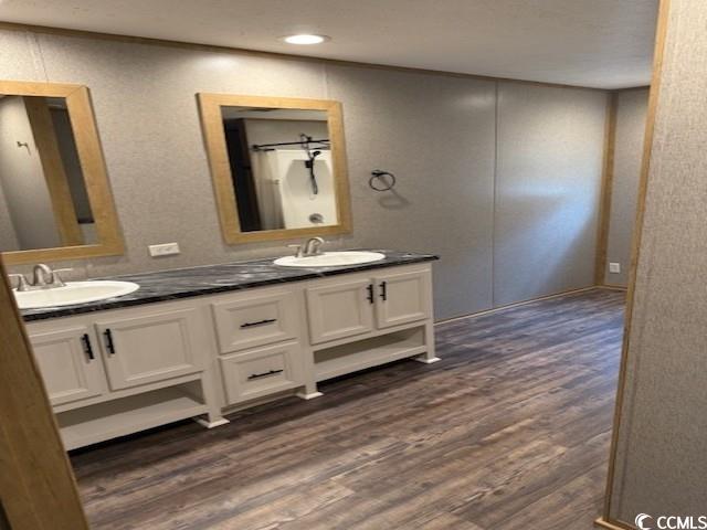 65 Clemmons Drive Tabor City, NC 28463 - Photo 16 of 29 Bathroom with double vanity and wood finished floors