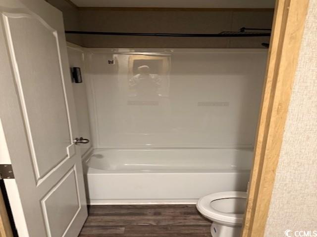 65 Clemmons Drive Tabor City, NC 28463 - Photo 23 of 29 Full bathroom with wood finished floors, toilet, and shower / bathtub combination