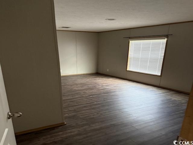 65 Clemmons Drive Tabor City, NC 28463 - Photo 24 of 29 Unfurnished room with wood finished floors and baseboards