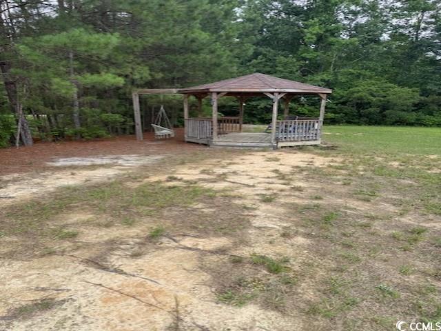 65 Clemmons Drive Tabor City, NC 28463 - Photo 8 of 29 View of yard with a gazebo