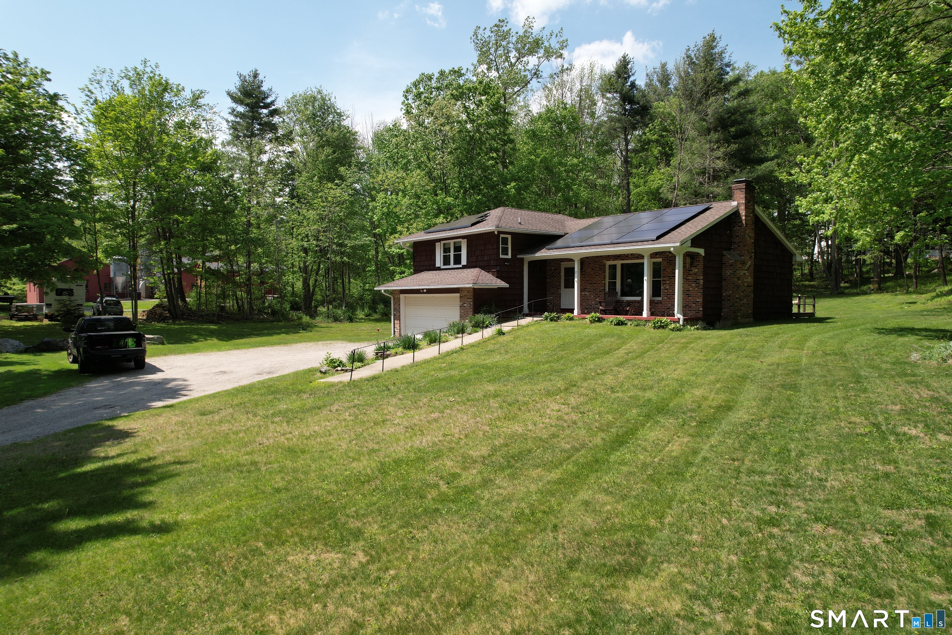 17 Colebrook Road Norfolk, CT 06058 - Photo 6 of 21 a front view of a house with a yard and trees