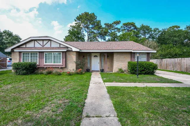 a front view of a house with yard