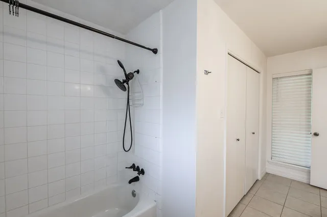 a bathroom with a bath tub