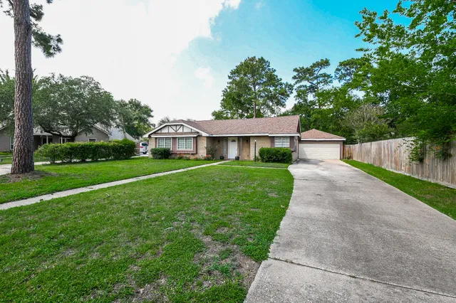 a front view of a house with yard
