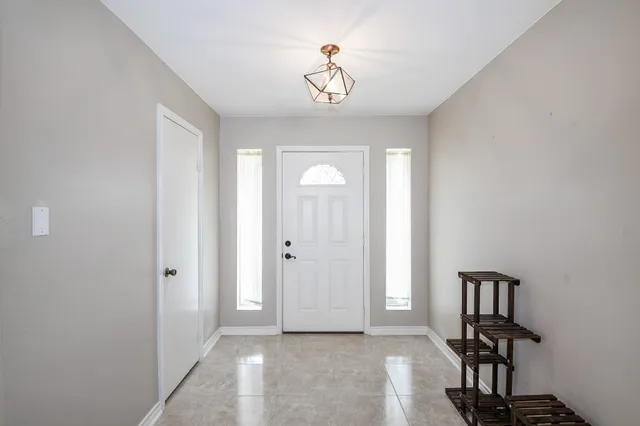 a view of entryway with chandelier