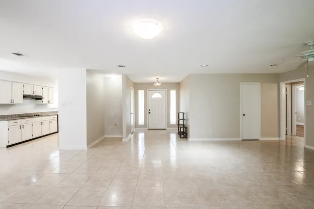 a view of a kitchen with a sink and a stove top oven