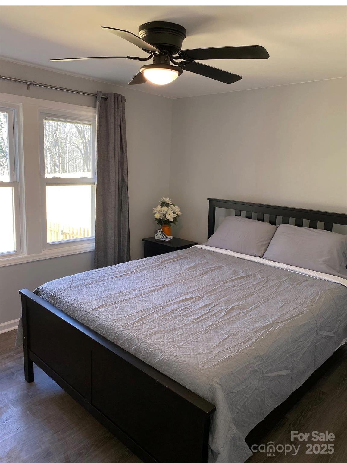 334 Mills Gap Road Asheville, NC 28803 - Photo 11 of 18 a bedroom with a bed and window