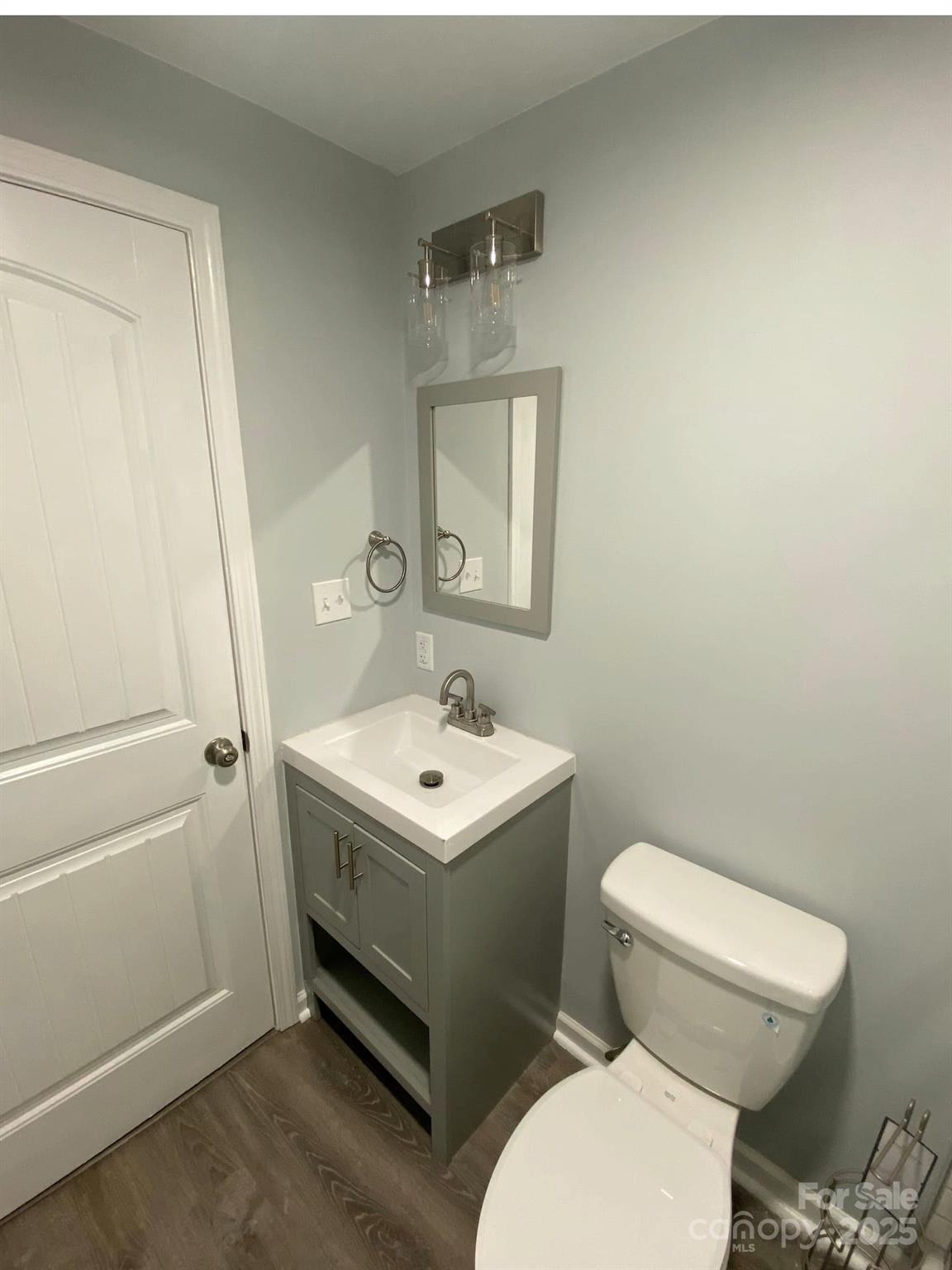 334 Mills Gap Road Asheville, NC 28803 - Photo 16 of 18 a bathroom with a toilet sink and mirror