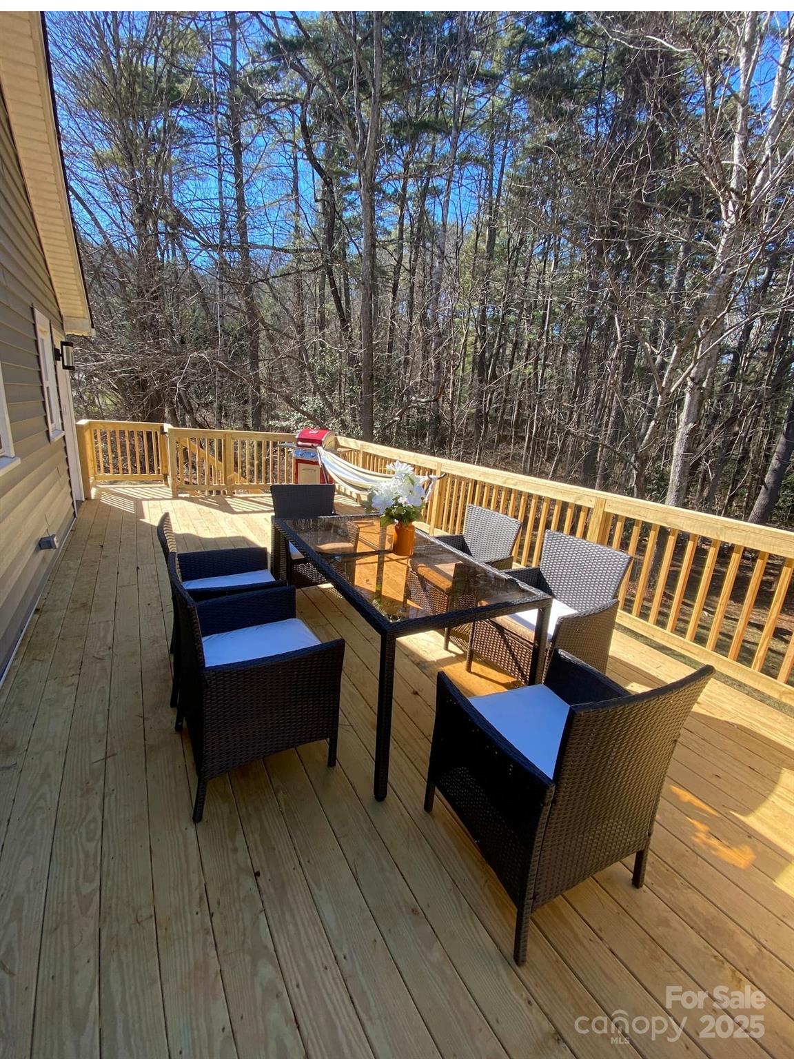 334 Mills Gap Road Asheville, NC 28803 - Photo 3 of 18 a view of a wooden deck with furniture