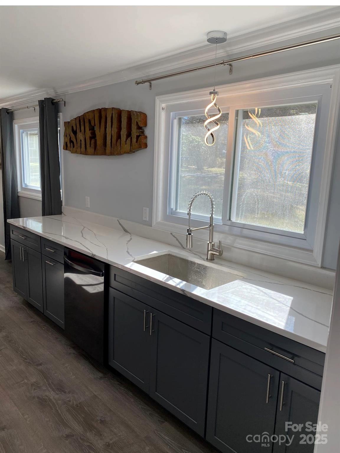 334 Mills Gap Road Asheville, NC 28803 - Photo 7 of 18 a kitchen with a sink and a window