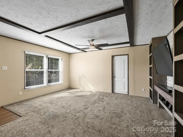 a view of empty room with windows