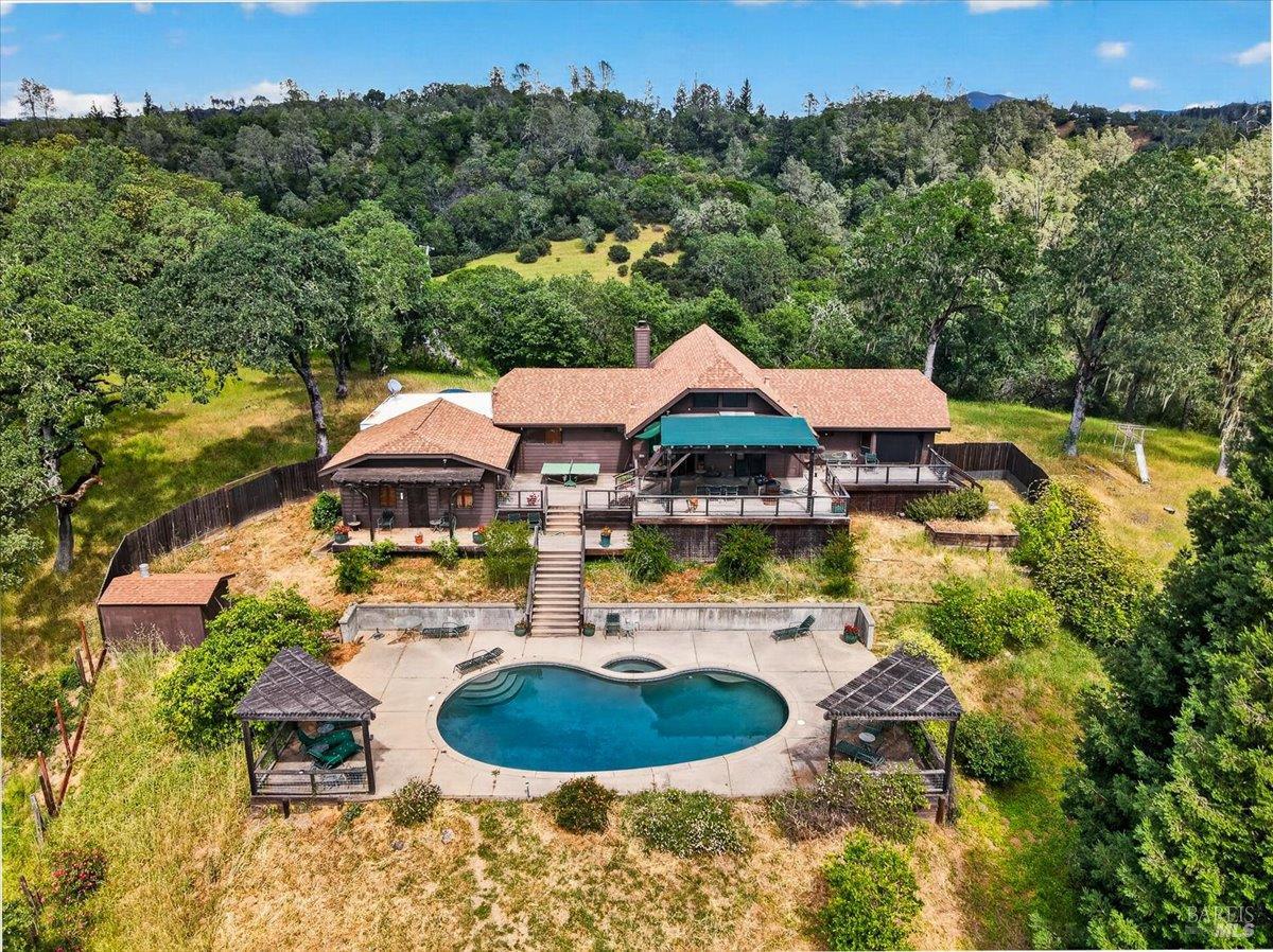 an aerial view of a house having yard
