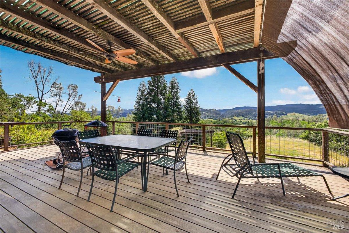 23881 Walling Road Geyserville, CA 95441 - Photo 23 of 40 a view of a chairs and table on the deck