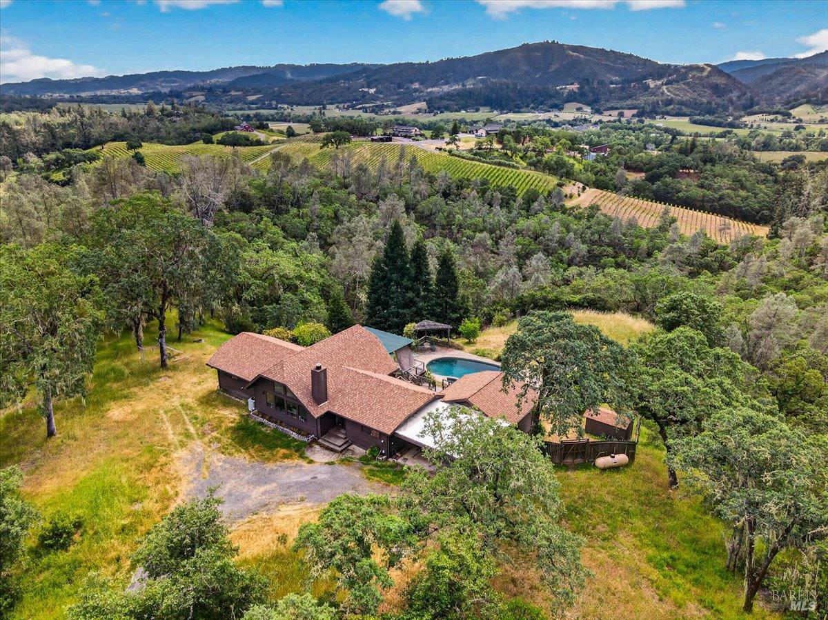 23881 Walling Road Geyserville, CA 95441 - Photo 36 of 40 a view of a house with a mountain