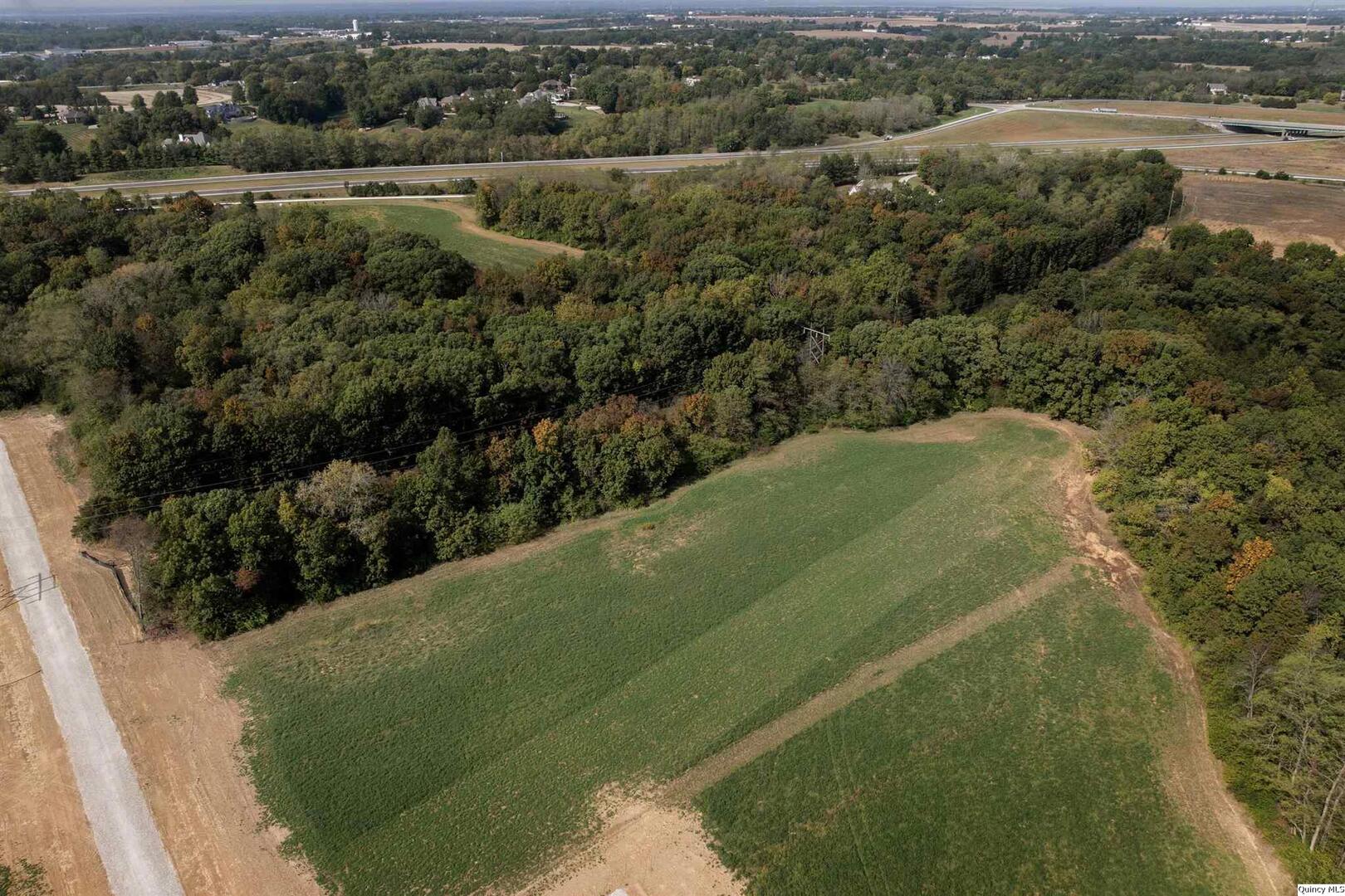 5911 Orchards Edge Lane Quincy, IL 62305 - Photo 4 of 12 a view of a field with an ocean