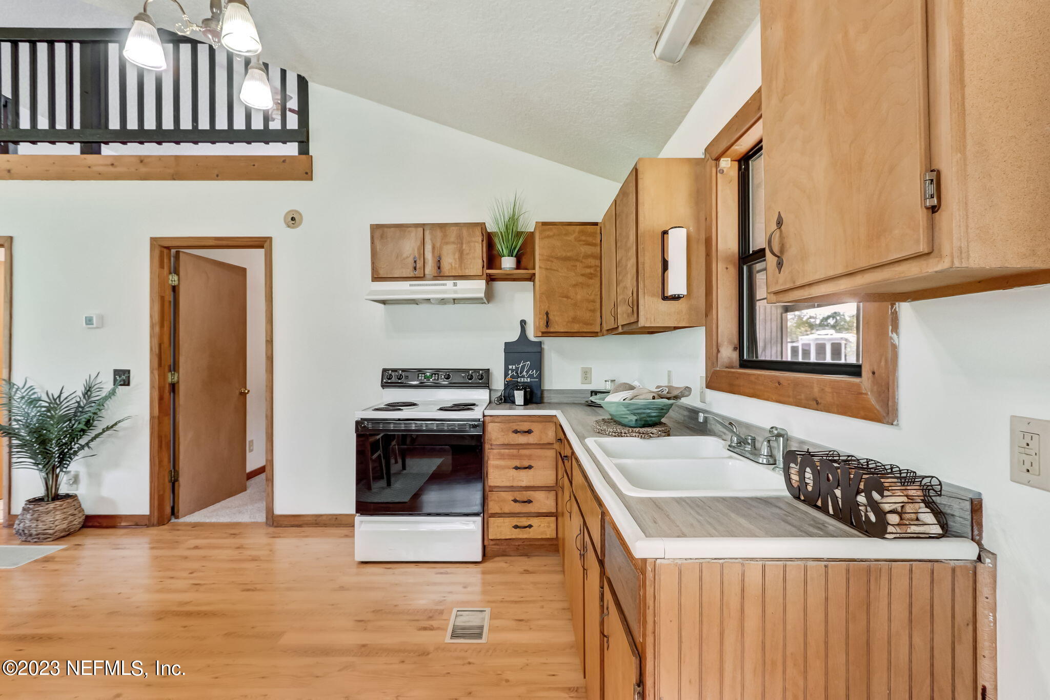 86105 Pages Dairy Road Yulee, FL 32097 - Photo 15 of 39 a kitchen with stainless steel appliances granite countertop a stove and a sink