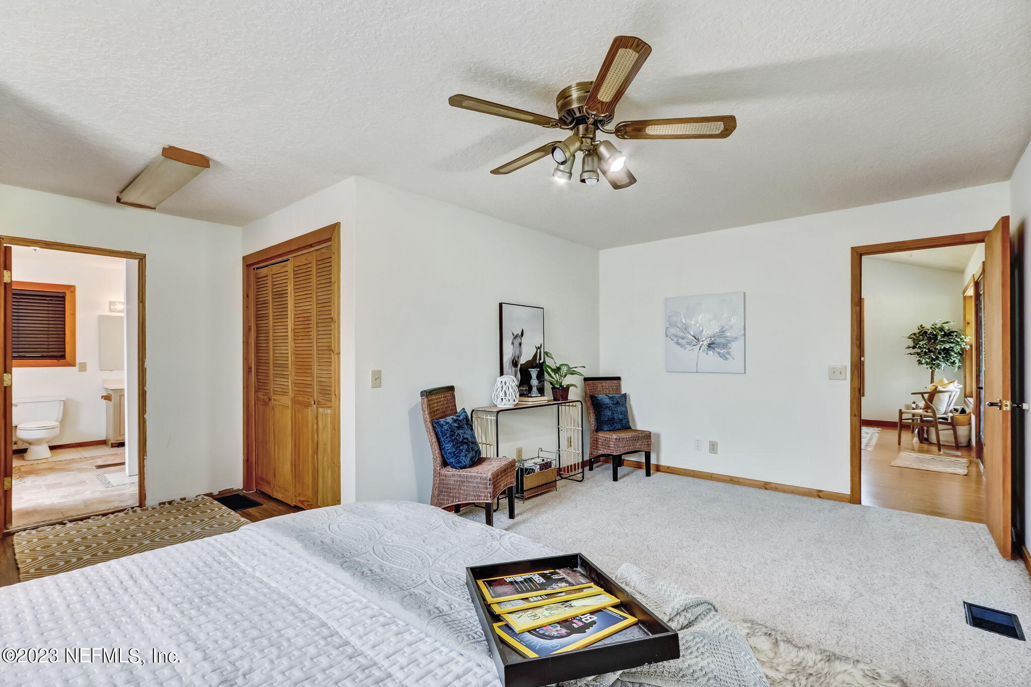 86105 Pages Dairy Road Yulee, FL 32097 - Photo 17 of 39 a bed room with a bed and a chandelier