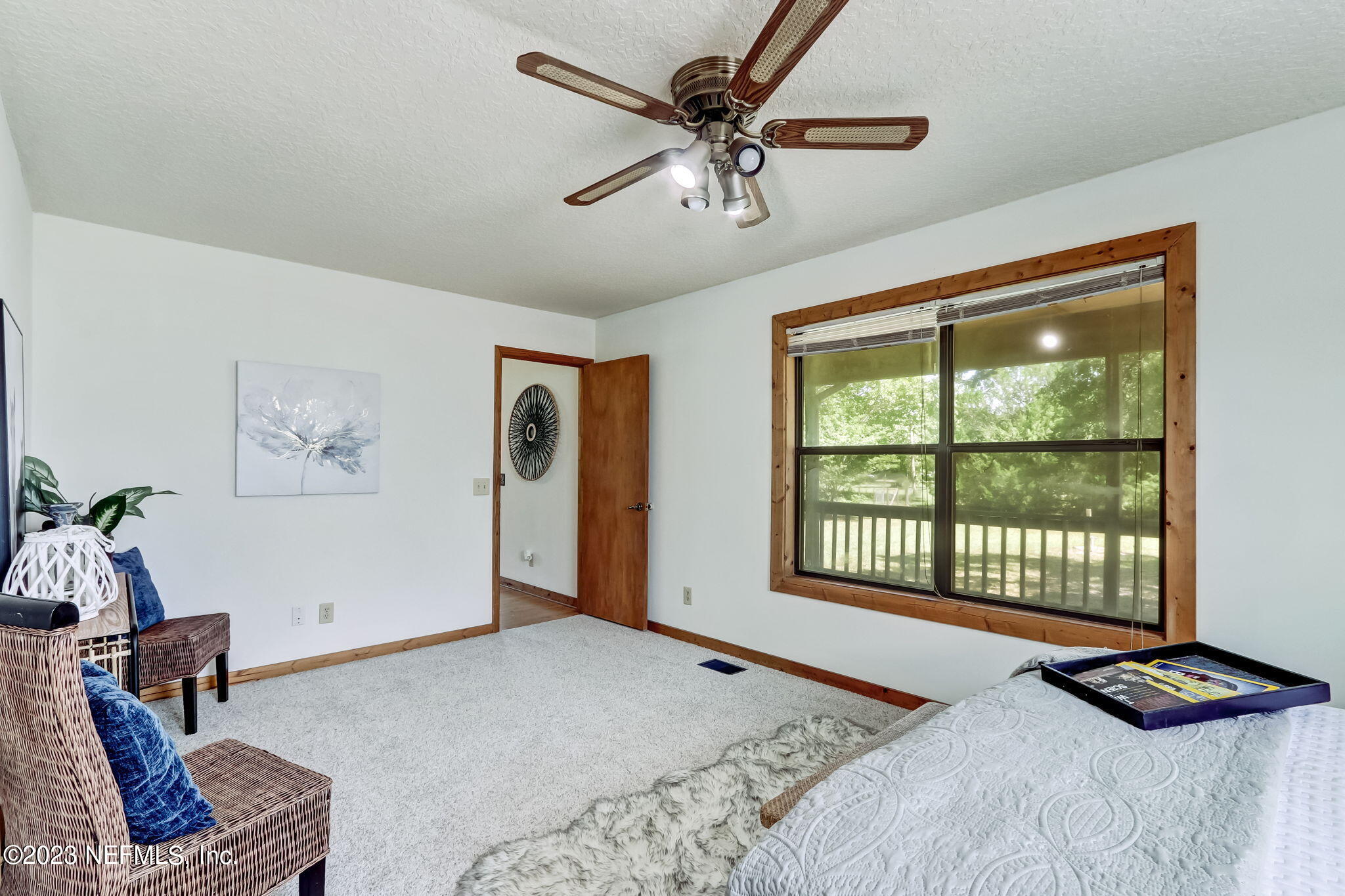 86105 Pages Dairy Road Yulee, FL 32097 - Photo 18 of 39 a bedroom with furniture and a window