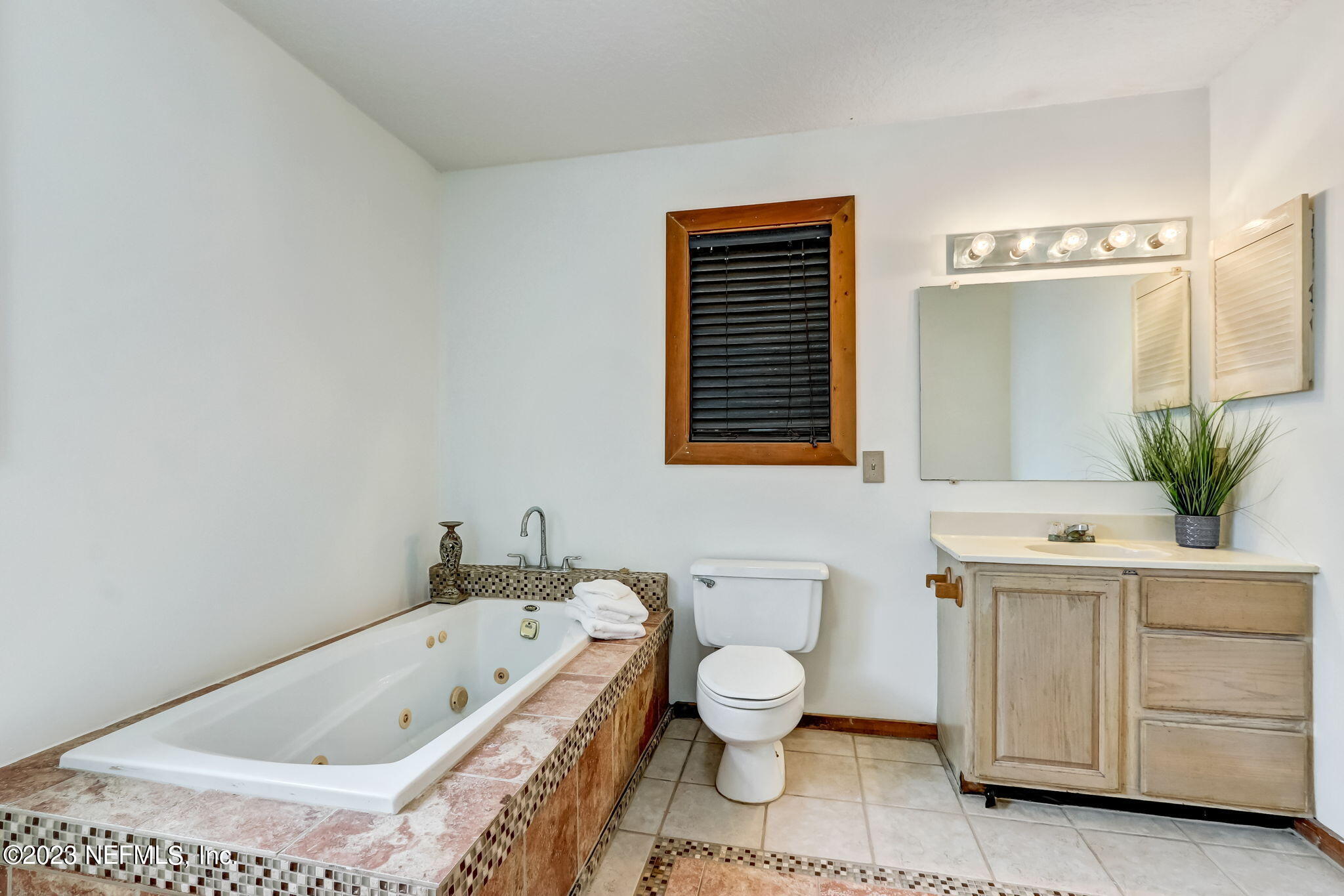 86105 Pages Dairy Road Yulee, FL 32097 - Photo 20 of 39 a bathroom with a sink a toilet and bathtub