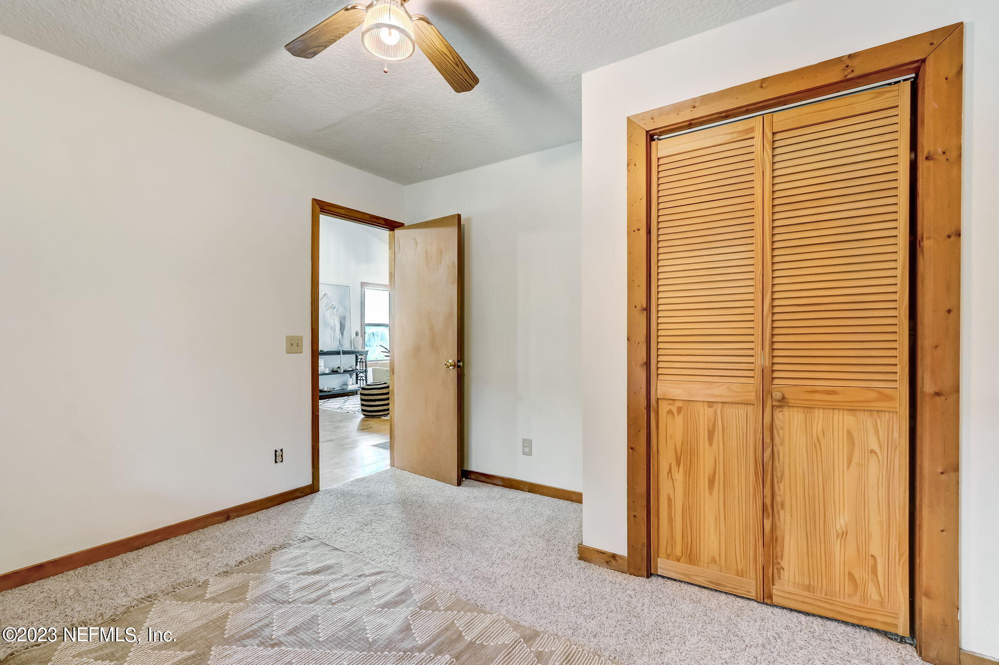 86105 Pages Dairy Road Yulee, FL 32097 - Photo 23 of 39 an empty room with a window and a ceiling fan