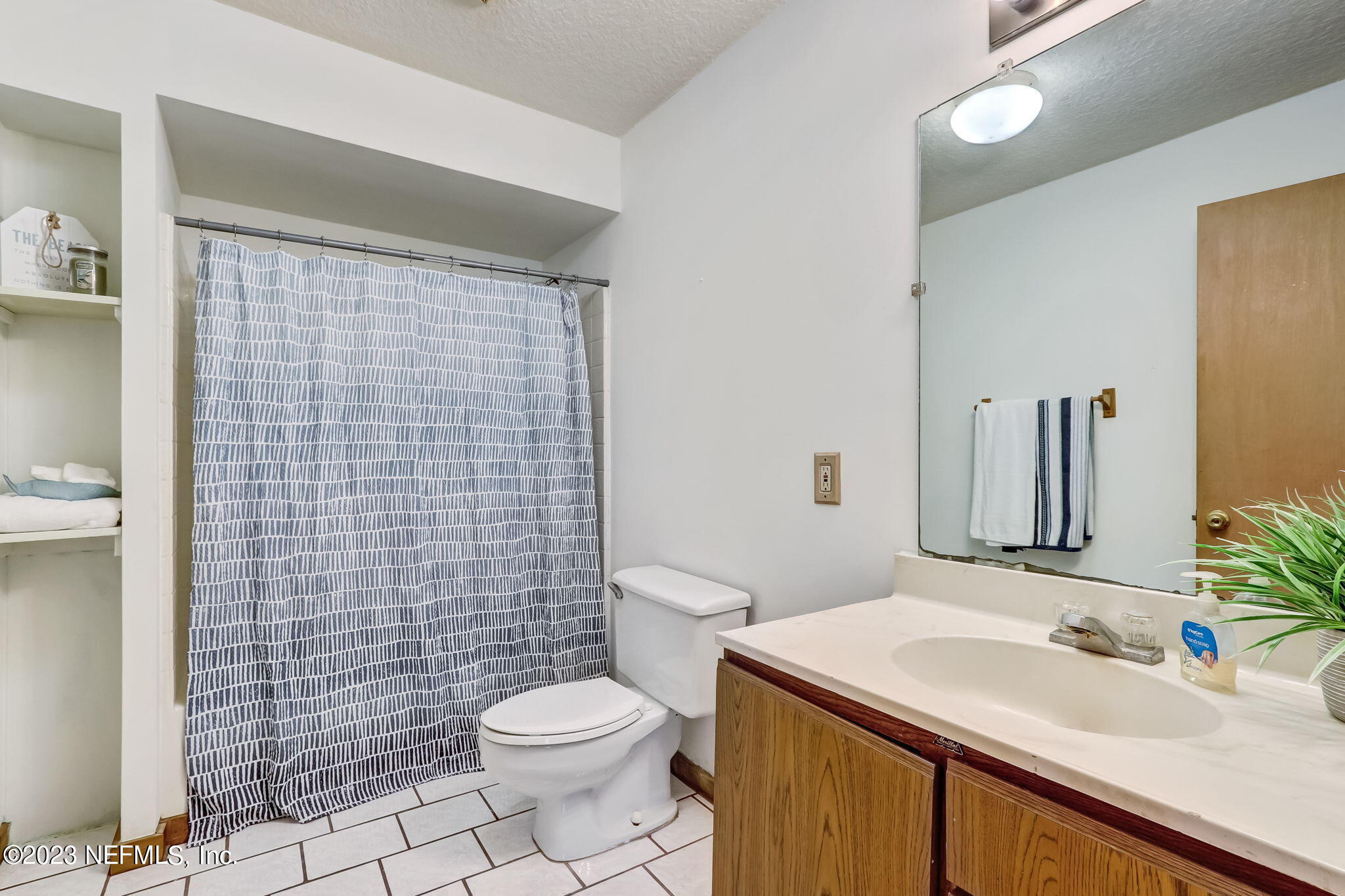 86105 Pages Dairy Road Yulee, FL 32097 - Photo 24 of 39 a bathroom with a sink a toilet and shower
