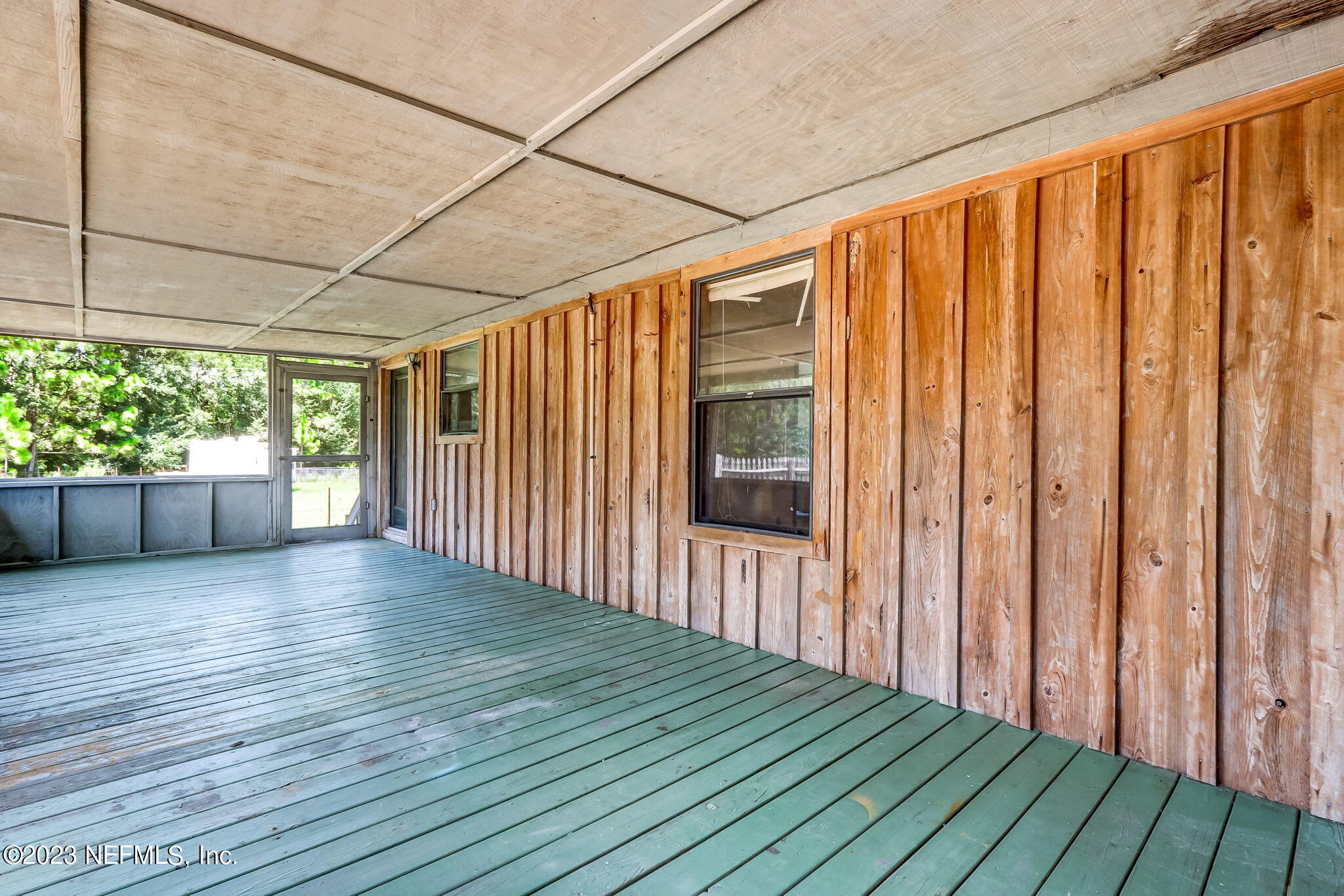 86105 Pages Dairy Road Yulee, FL 32097 - Photo 30 of 39 an empty room with wooden floor and windows