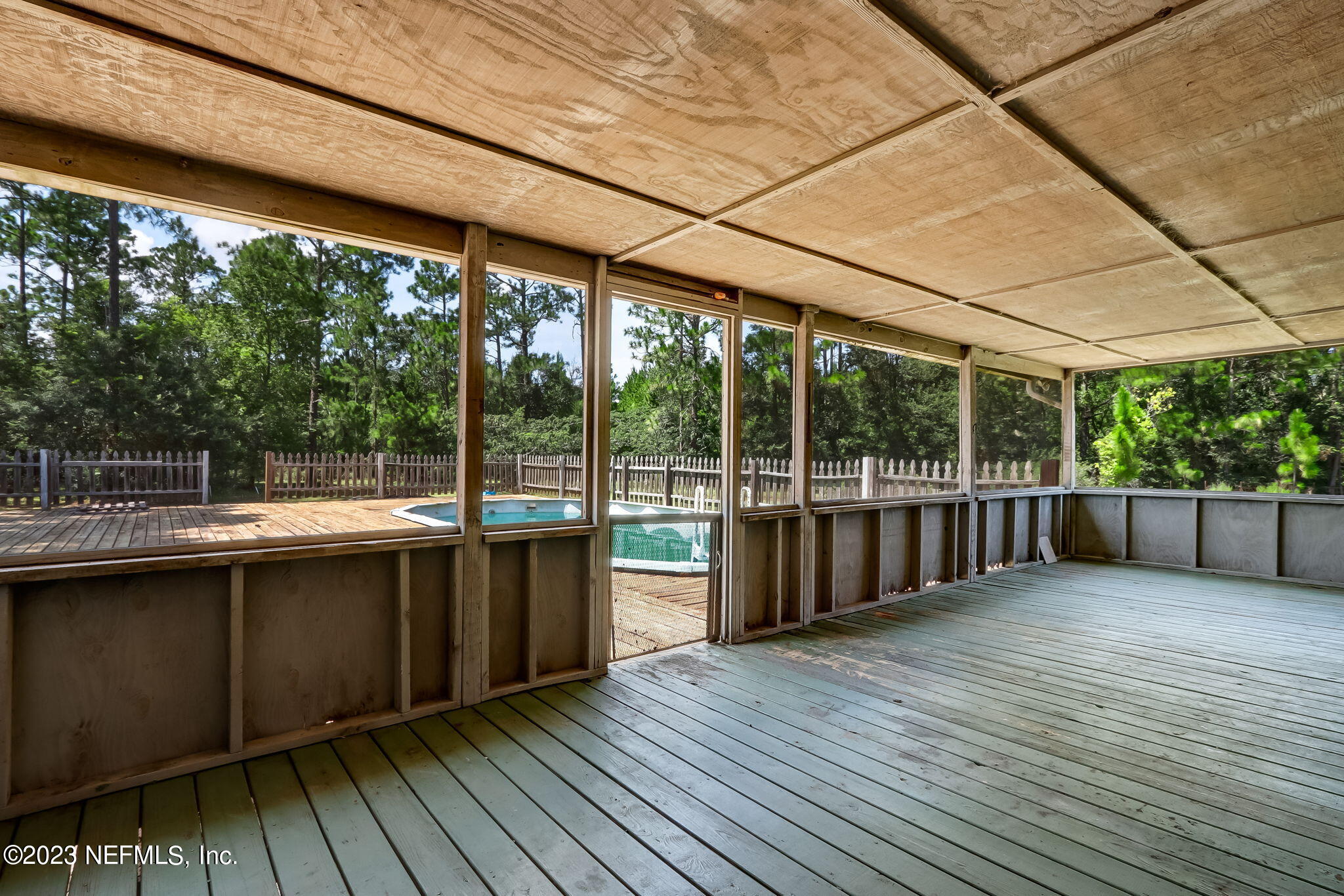 86105 Pages Dairy Road Yulee, FL 32097 - Photo 31 of 39 a view of a deck with wooden floor and outdoor space