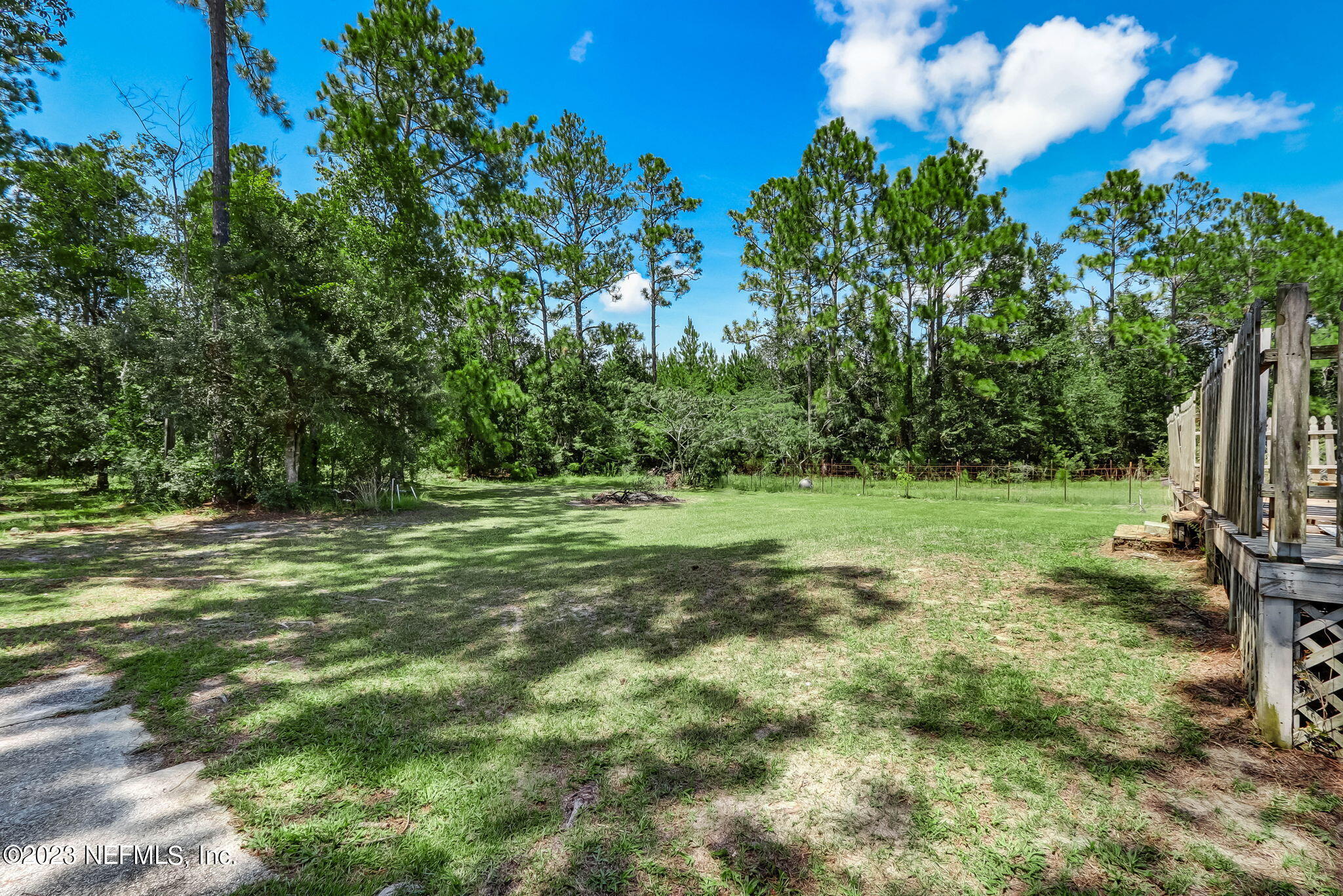 86105 Pages Dairy Road Yulee, FL 32097 - Photo 39 of 39 a view of a field with tree in the background