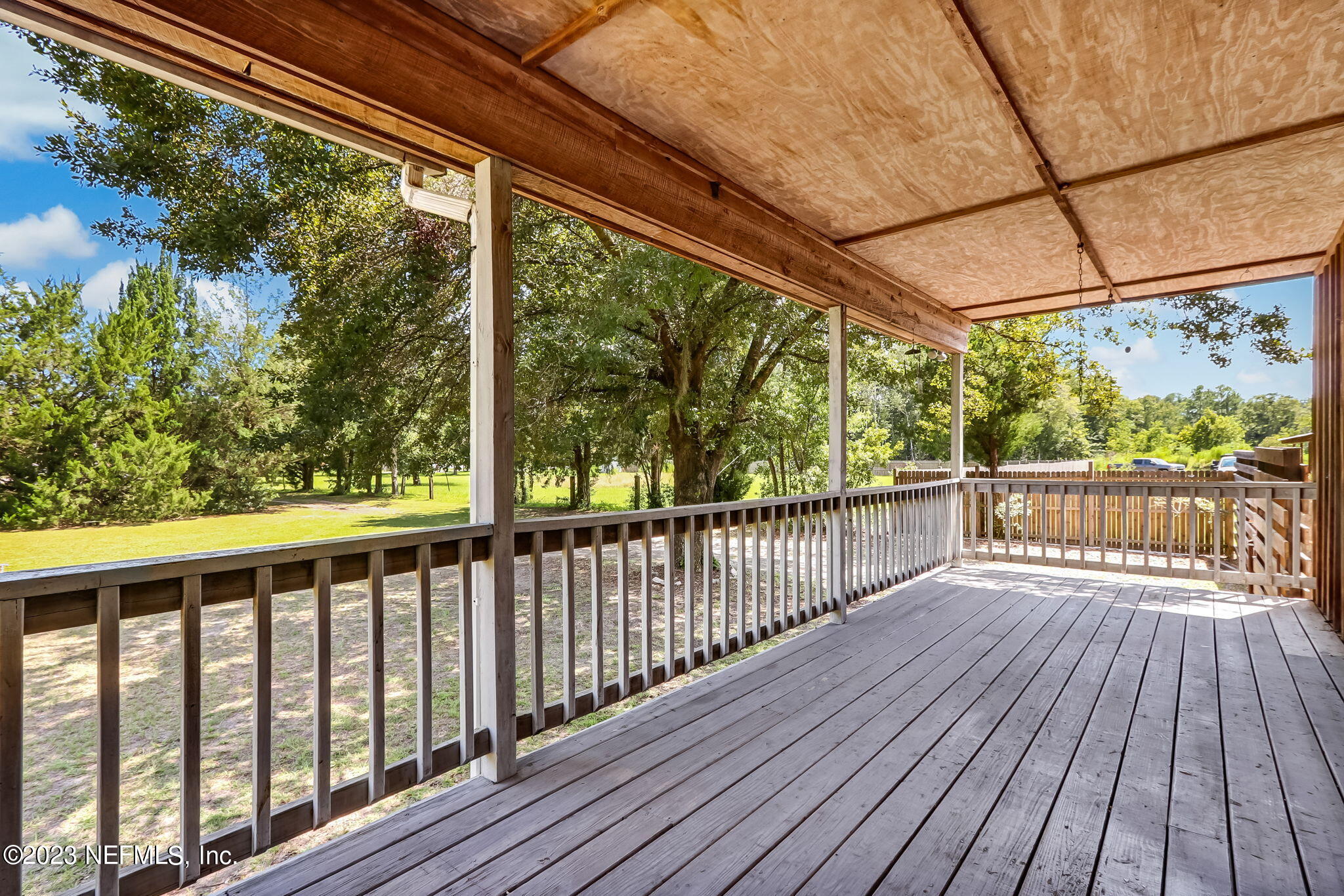 86105 Pages Dairy Road Yulee, FL 32097 - Photo 4 of 39 a view of balcony with wooden floor