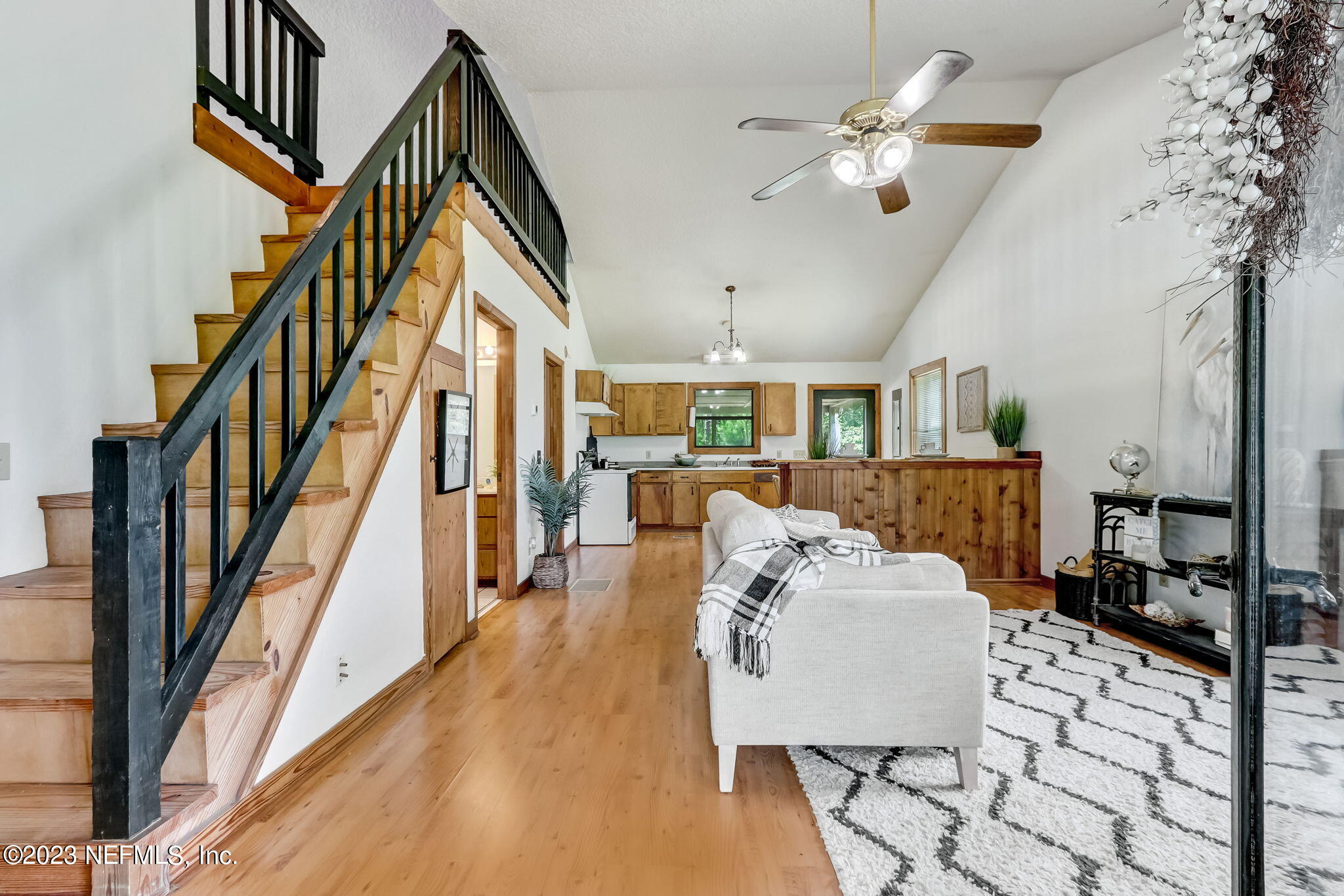 86105 Pages Dairy Road Yulee, FL 32097 - Photo 5 of 39 a living room with furniture and a chandelier