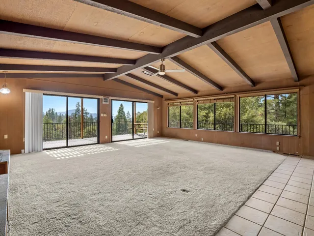 a view of an empty room with a balcony