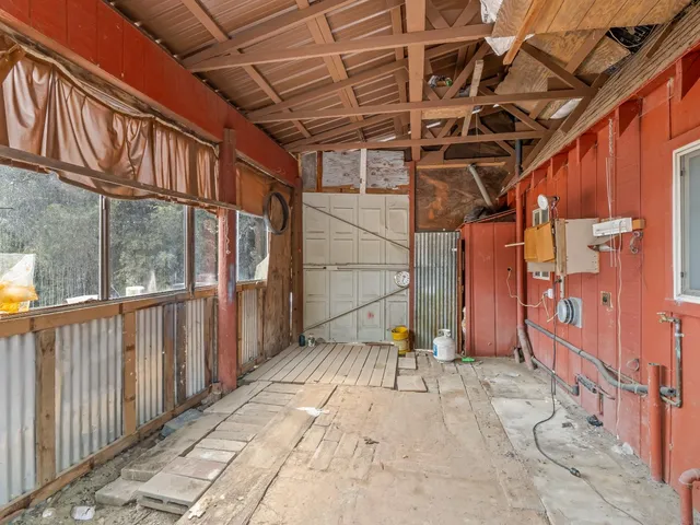 a view of porch with wooden floor