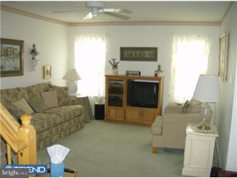 78 Biddle Way Mount Laurel, NJ 08054 - Photo 3 of 8 a living room with furniture and a fireplace