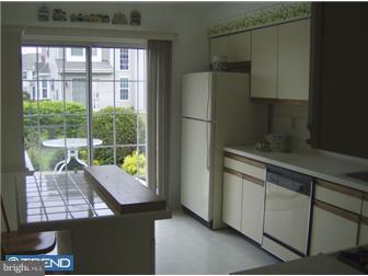 78 Biddle Way Mount Laurel, NJ 08054 - Photo 6 of 8 a view of a kitchen with an empty space and a window