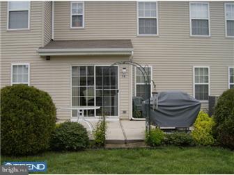 78 Biddle Way Mount Laurel, NJ 08054 - Photo 7 of 8 a front view of a house with a yard