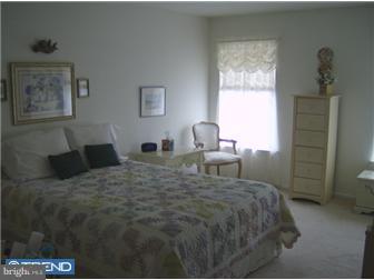 78 Biddle Way Mount Laurel, NJ 08054 - Photo 8 of 8 a bed sitting in a bedroom next to a window