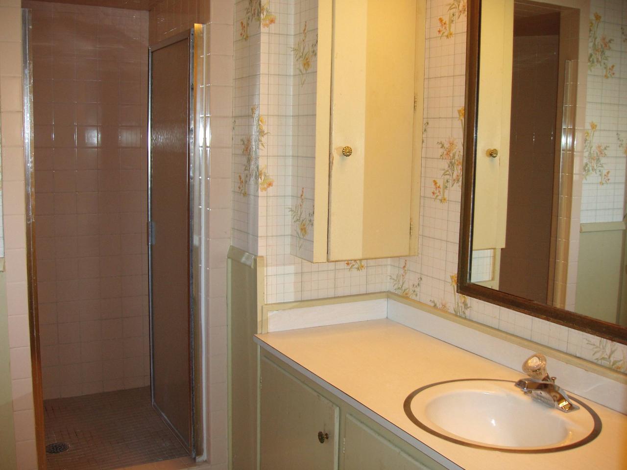 7114 Jameson Road Amarillo, TX 79106 - Photo 8 of 13 a bathroom with a sink and a mirror