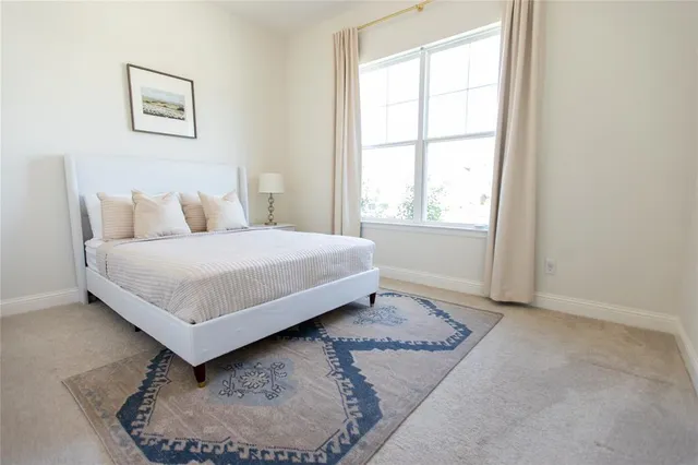 a view of a living room with a window and chandelier