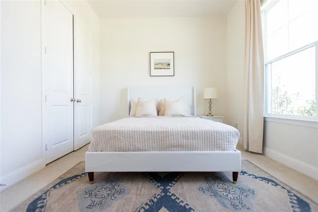a living room with a couch and a chandelier