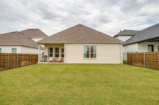a bedroom with furniture and a wooden floor