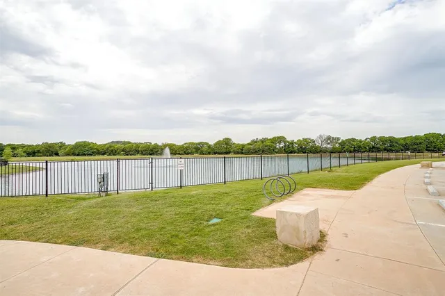 a view of a balcony with a table and chairs