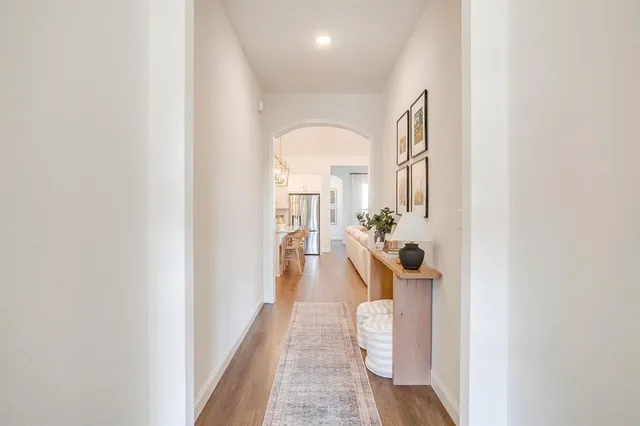 a view of a hallway with a potted plant