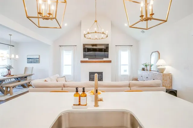 a view of swimming pool with outdoor seating and a garden