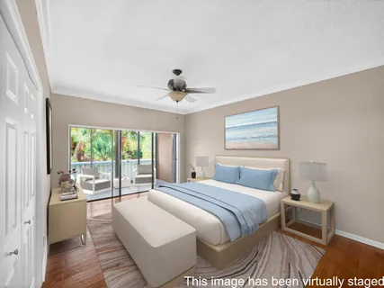 a bedroom with a large bed and a large window