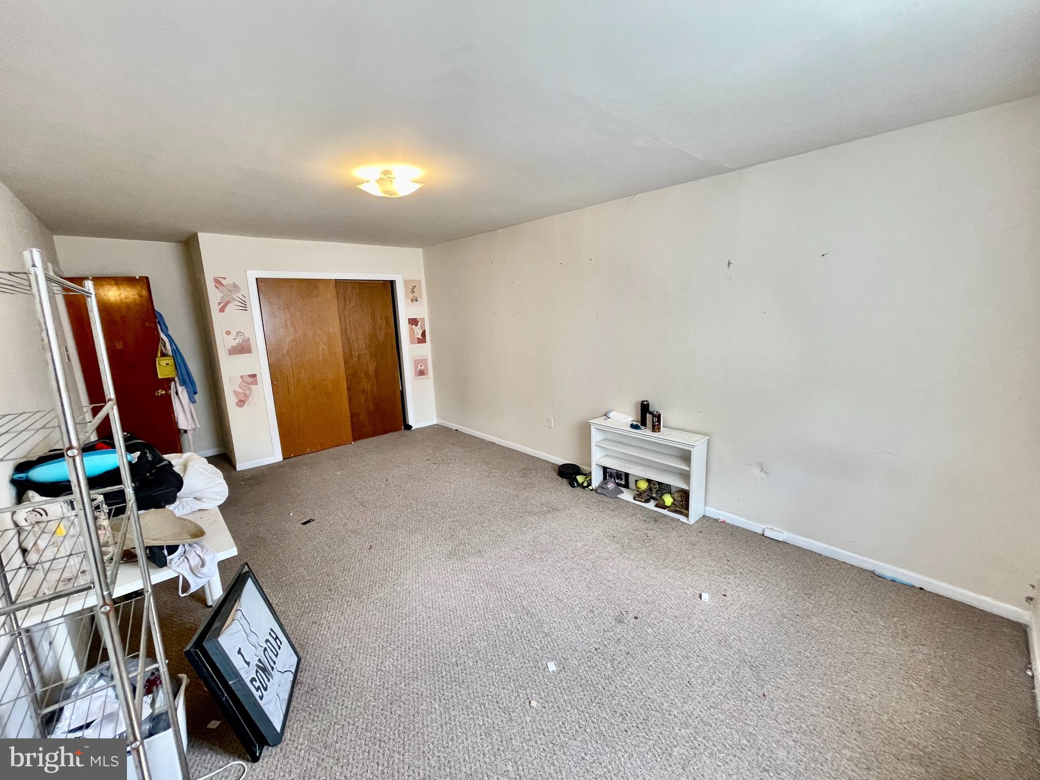 4167 Terrace Street, Unit A Philadelphia, PA 19128 - Photo 12 of 15 a living room with furniture and a flat screen tv