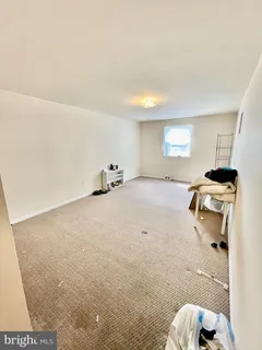 a room with gym equipment and a flat screen tv