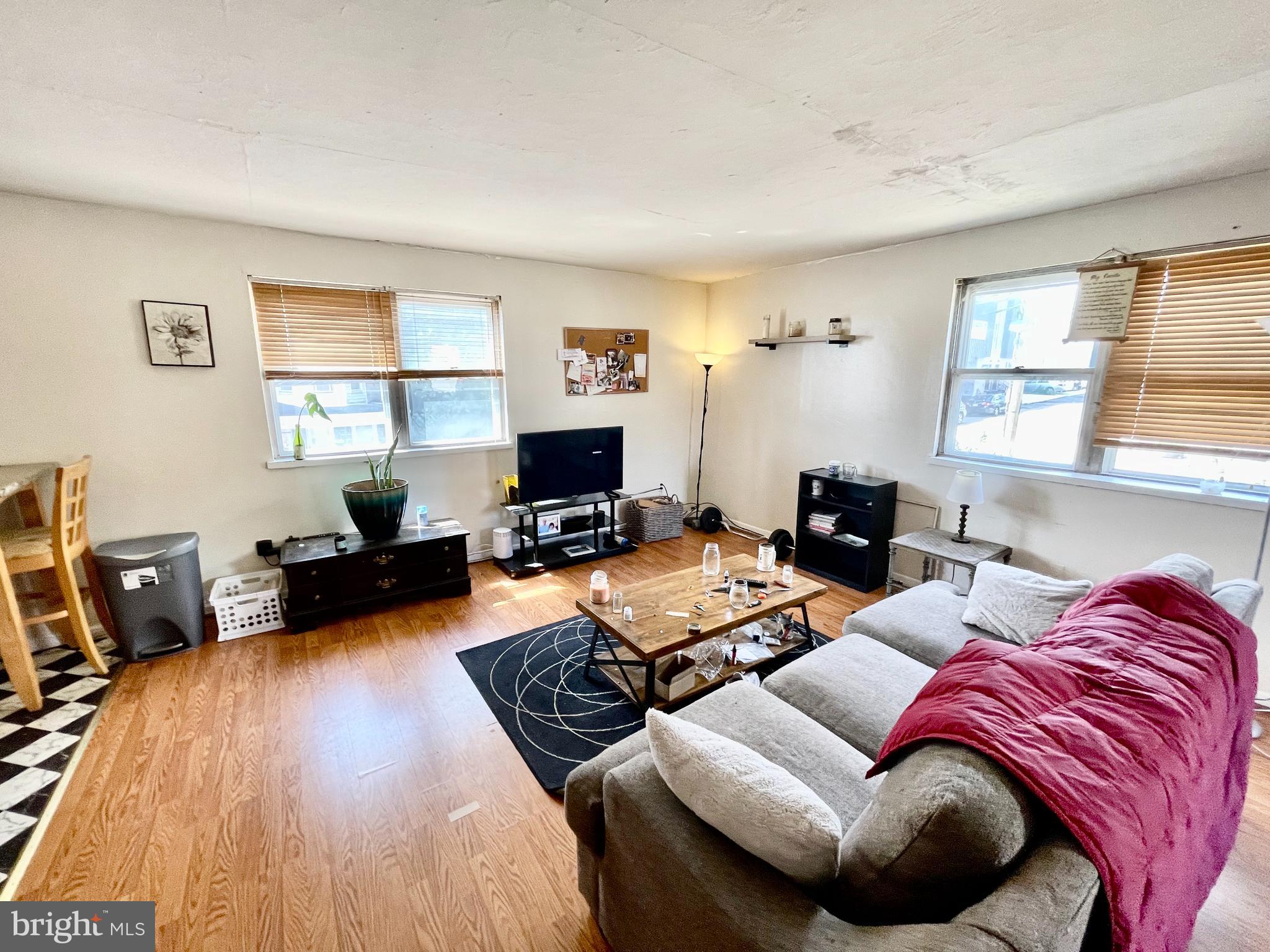 4167 Terrace Street, Unit A Philadelphia, PA 19128 - Photo 5 of 15 a living room with furniture a flat screen tv and a window