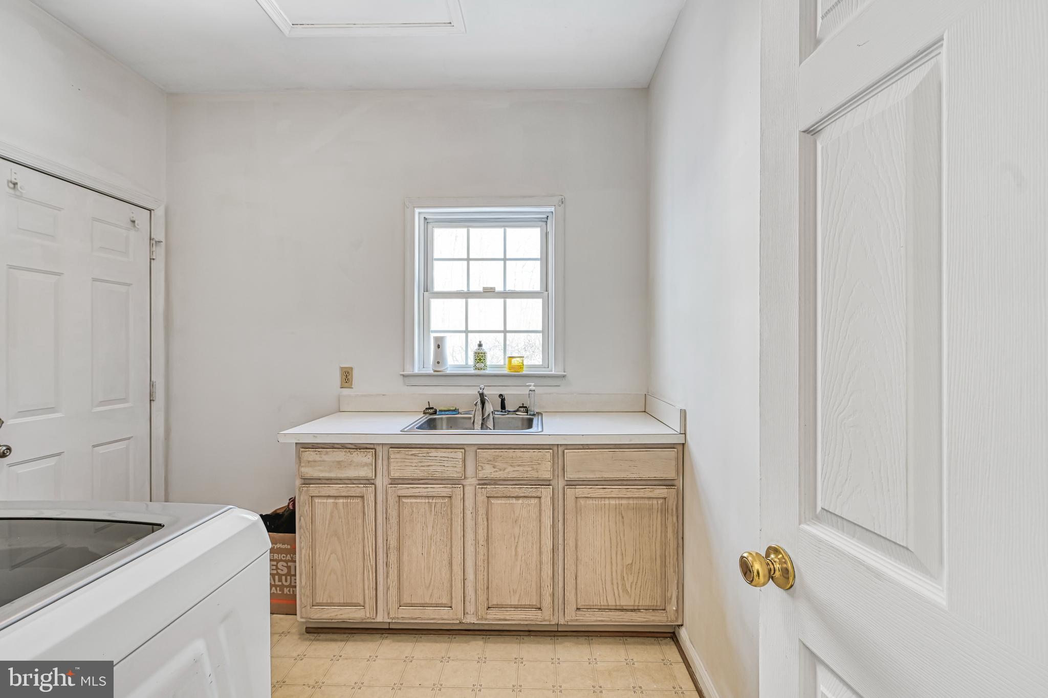441 Hartwood Road Fredericksburg, VA 22406 - Photo 13 of 58 a kitchen with a sink a stove cabinets and a window