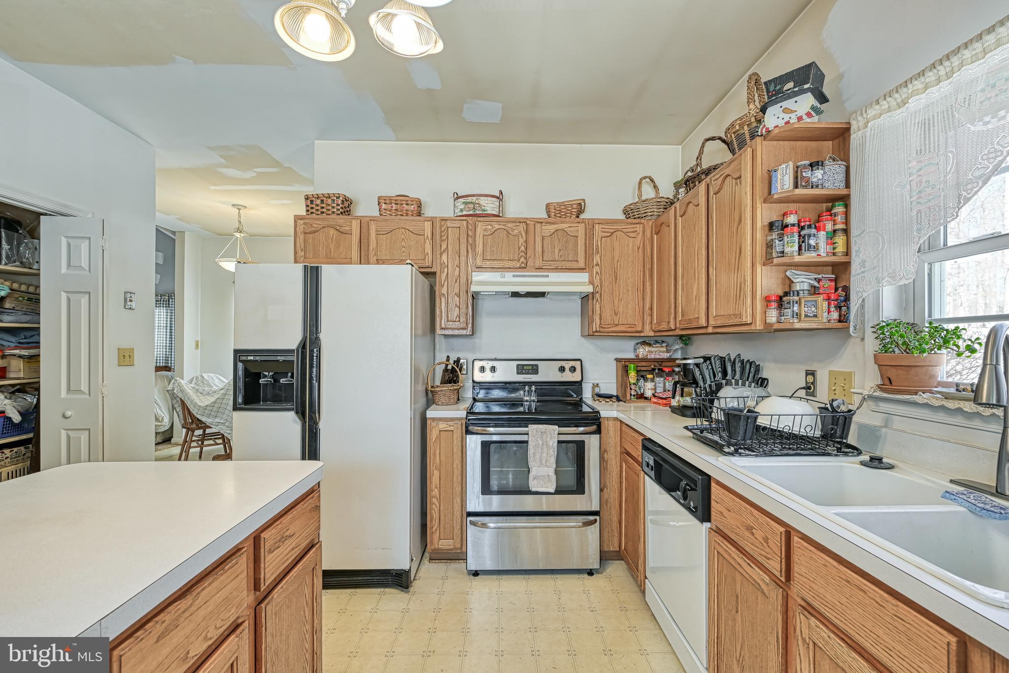 441 Hartwood Road Fredericksburg, VA 22406 - Photo 18 of 58 a kitchen with a sink stove and refrigerator