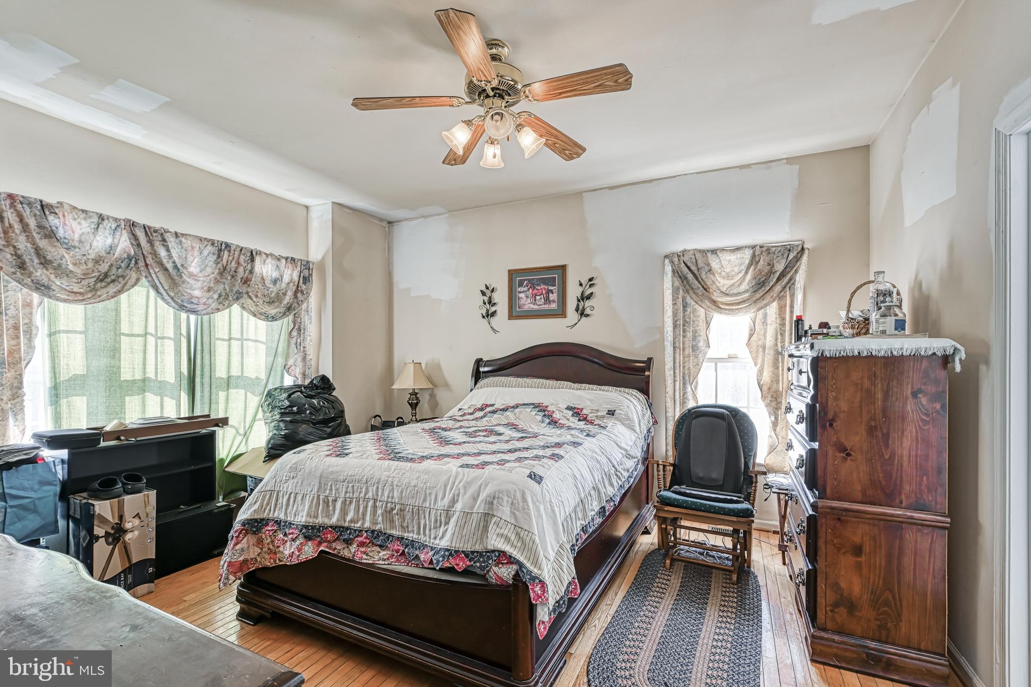 441 Hartwood Road Fredericksburg, VA 22406 - Photo 22 of 58 a bedroom with a bed and wooden floor